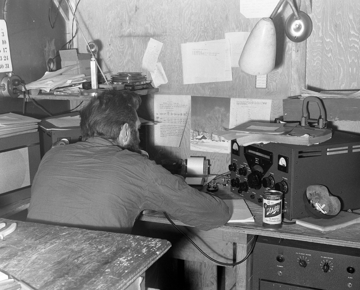 Cliff Dickey works a ham radio at South Pole