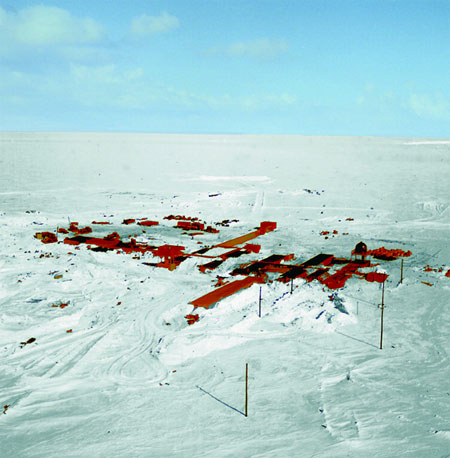 Aerial view of buildings on snow.