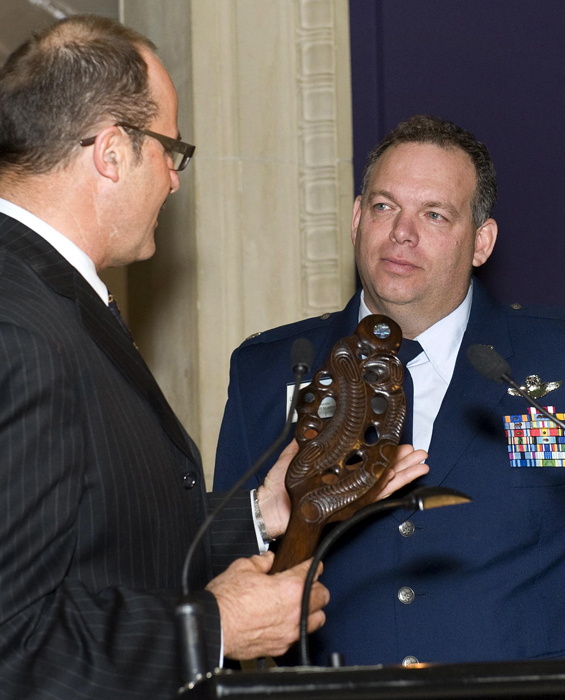 Lt. Col. Jim McGann, right, receives recognition for service.