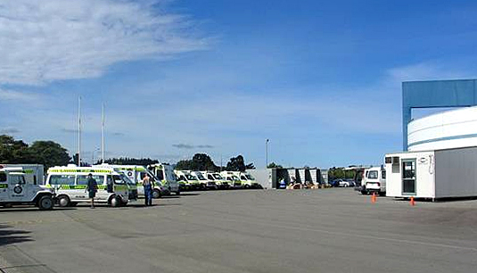 Ambulances in a parking lot.