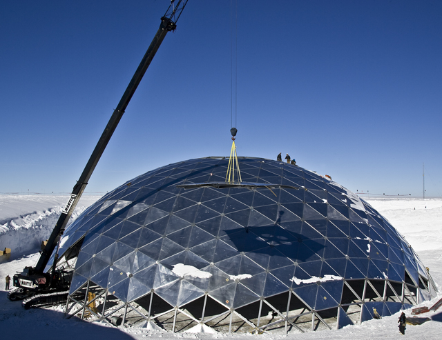 Crane removes panel from dome.