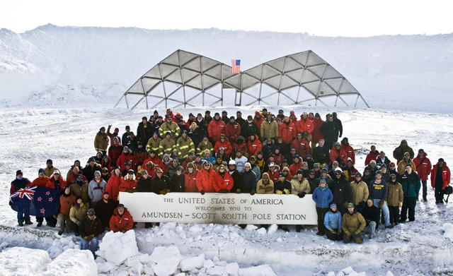 The whole South Pole Station crew poses in front of the last panel.