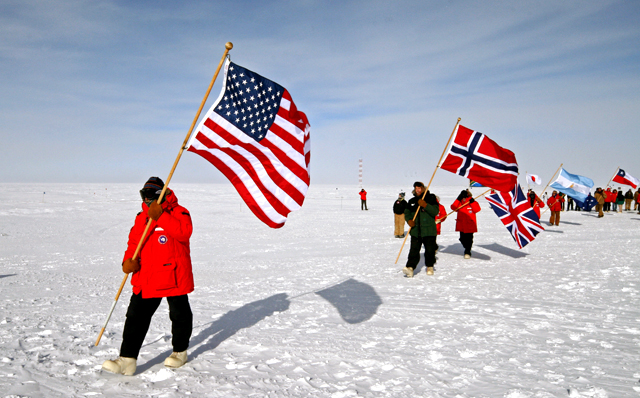 Jerry Marty takes part of South Pole flag ceremony.