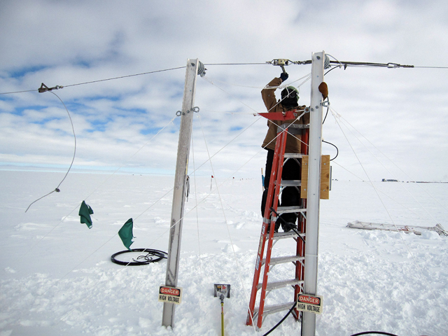 Robert Fuhrmann repairs a South Pole experiment.