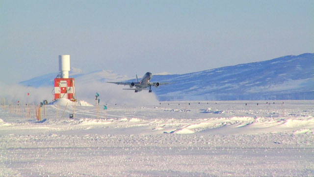 Plane lifts off from ice runway.