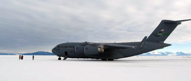 Large airplane sits on ice.
