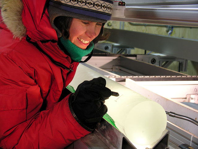 A researcher examines an ice core.
