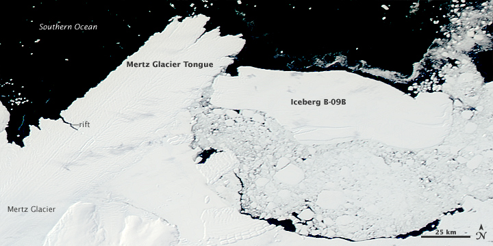 Iceberg collides with glacier tongue.