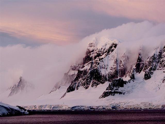 Rugged mountains topped by ice.