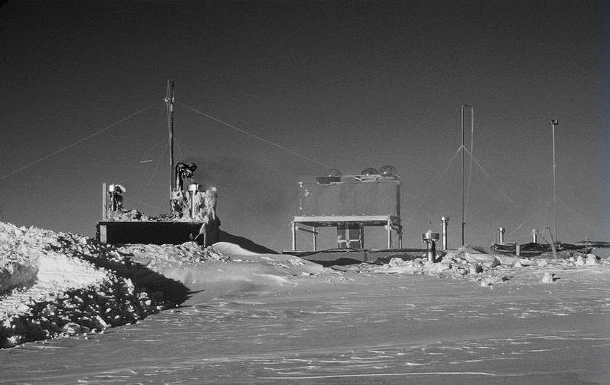 Black and white photo of structures on ice.