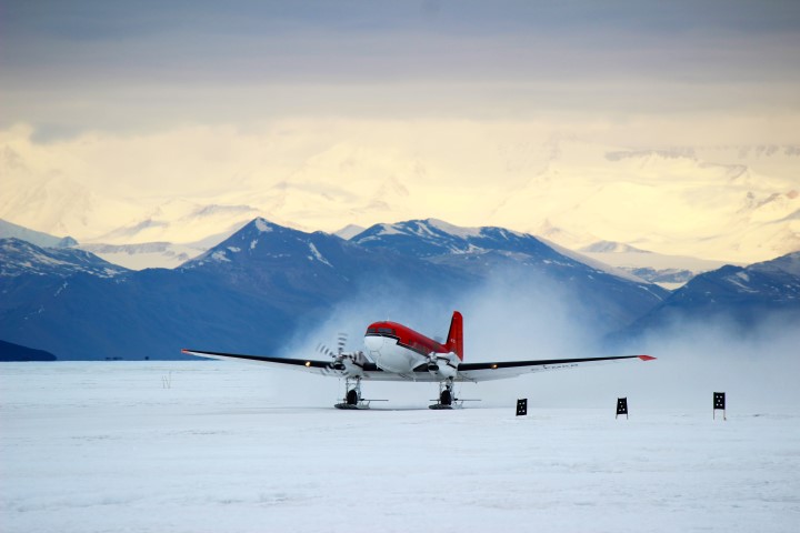 Planes takes off from ice runway.