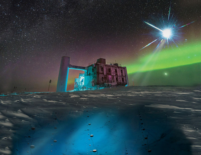 This artist’s rendering of the IceCube Lab at the South Pole depicts the light detectors, called DOMs, buried under the ice (not to scale)