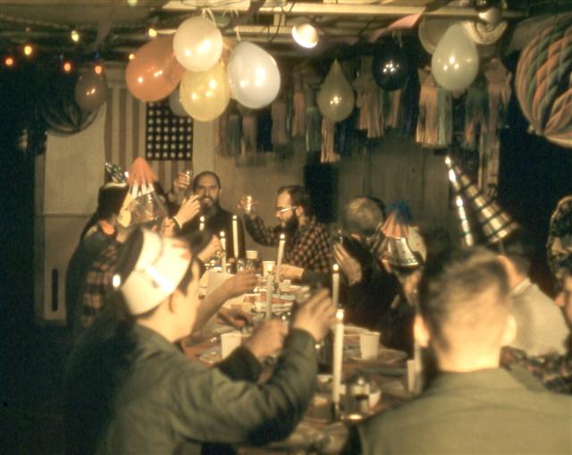 Men having a party with balloons.