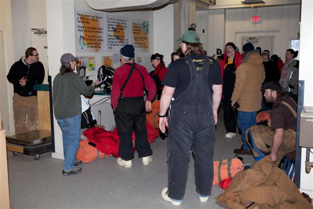 Passengers prepare to depart McMurdo Station.
