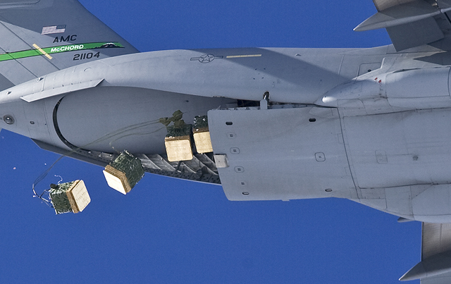 An Air Force C-17 drops cargo over South Pole.