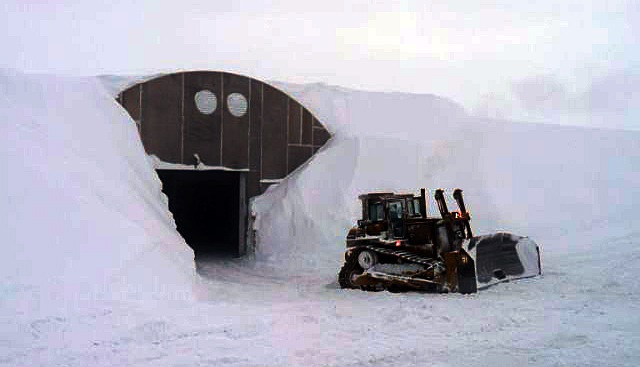 Snow piled high around the garage arch at South Pole.