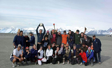 Group of people with mountains in distance.