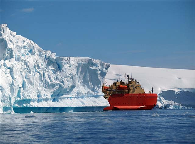 Ship navigates through icebergs.