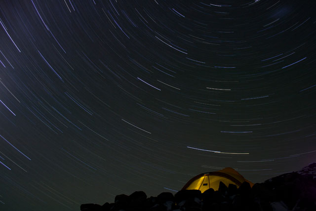 A tent under the night sky.