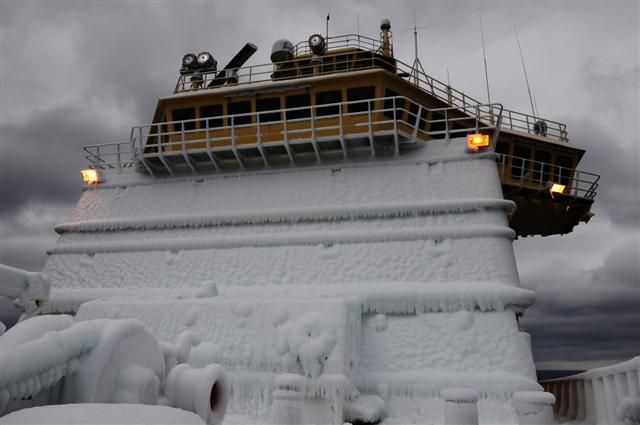 Bridge of ship covered in ice.