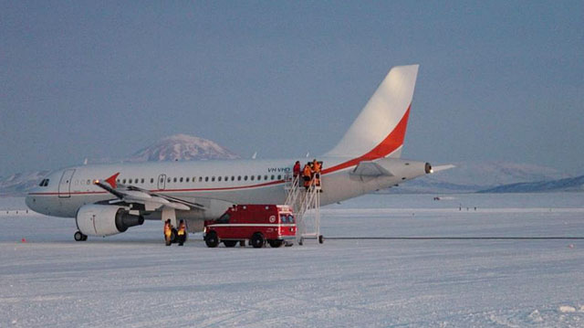Airplane sits on ice.