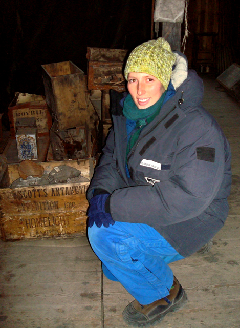 Susanne Grieve inspects artifacts in Discovery Hut.