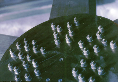 Gusset Plate showing installed Huck bolts.