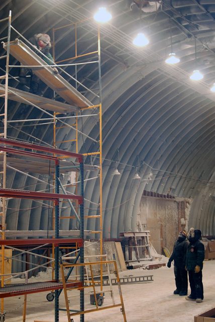 Crew installs lighting in logistics arch at South Pole.