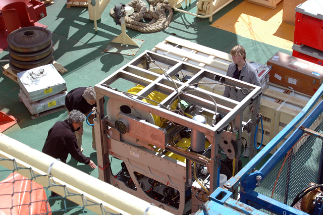 People examine cargo aboard the Palmer.