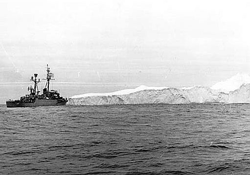 A picket ship near an iceberg.