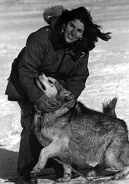 Elena Marty with a husky dog.