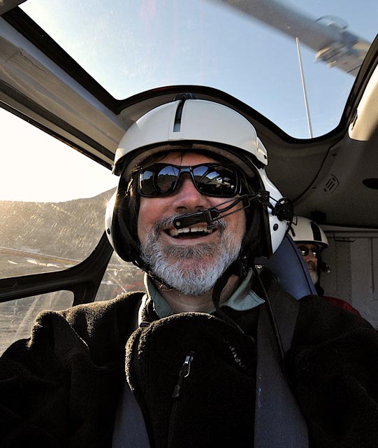 Person in a helicopter cockpit.