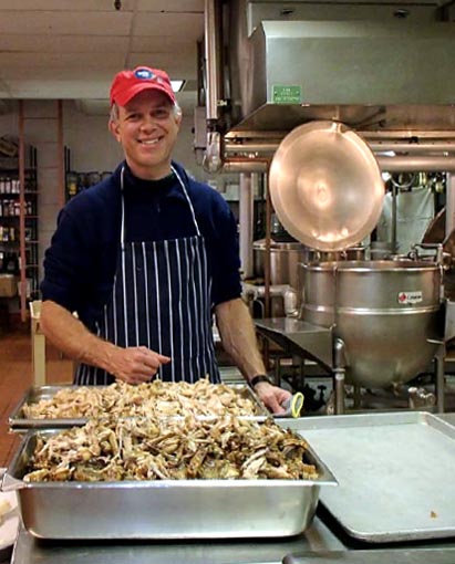 Person cooking in a kitchen.