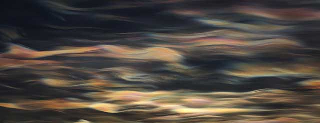 Clouds with various colors in sky.