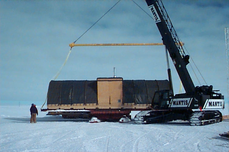 Crane lifts building.