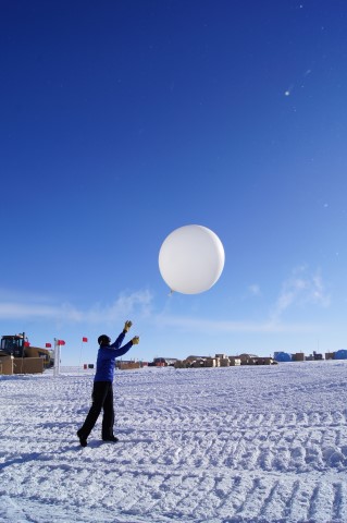 Person release balloon into the air.