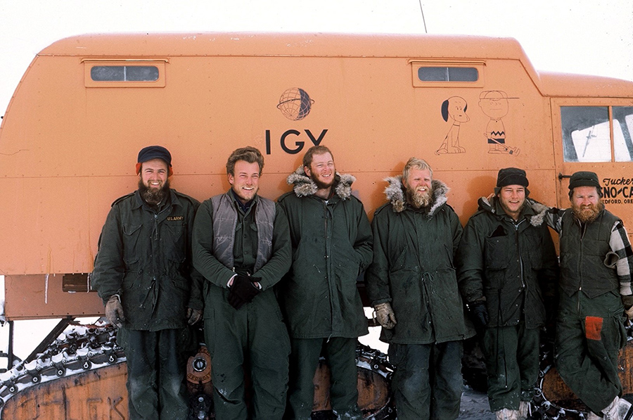 Charles Bentley, far left, and the rest of the Byrd Station traverse team pose in front of a Tucker Sno-Cat