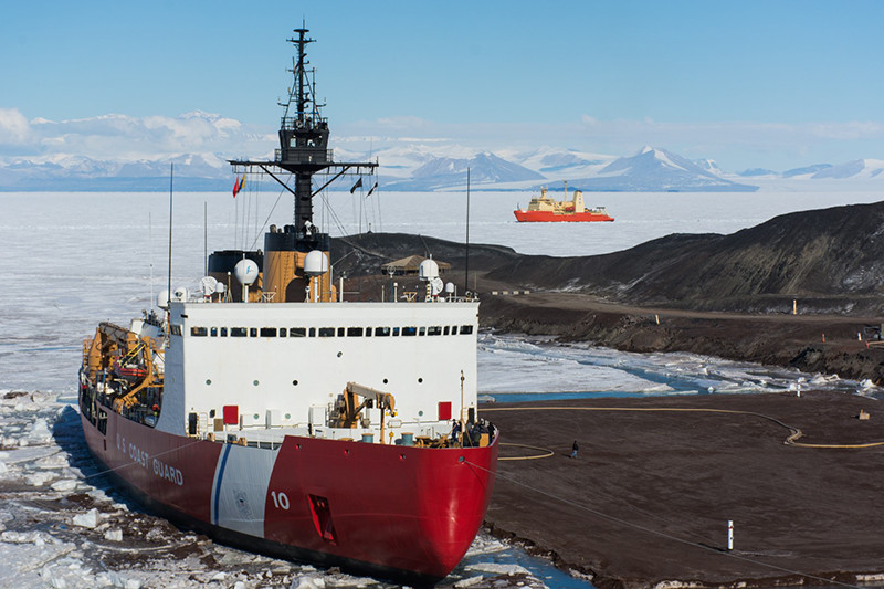 The Icebreaker USCGC Polar Star sits docked at McMurdos ice pier