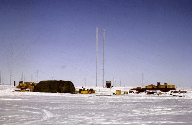 Two tall towers in middle of camp.