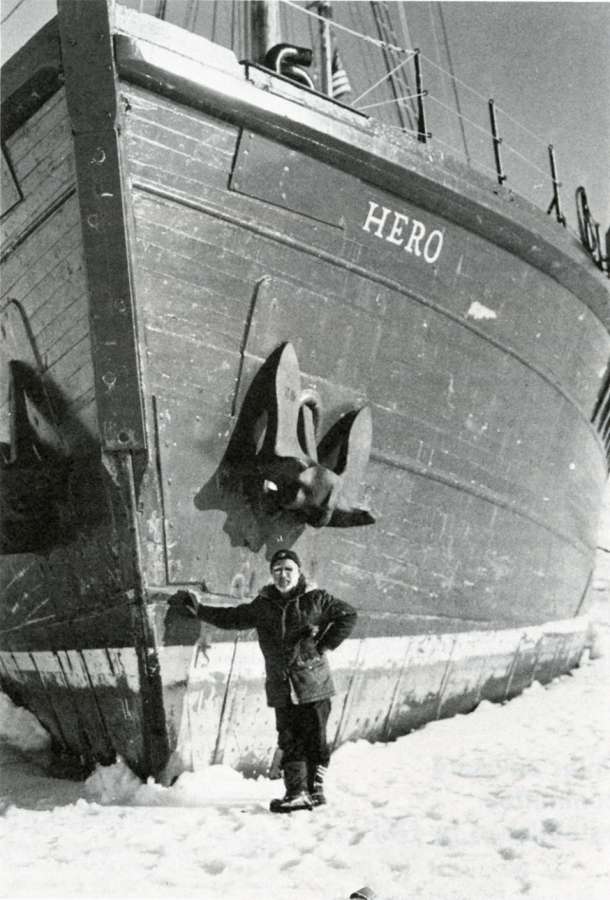 Person leans against bow of a ship.