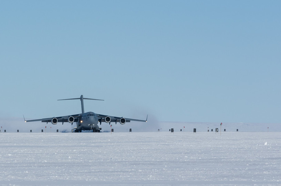 A C-17 touches down on the Phoenix Airfield, the first landing of a wheeled aircraft on the new landing strip