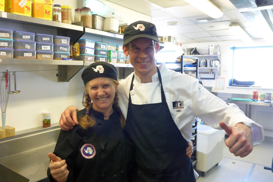 Betsy Rosengarden gets a thumbs up from summer chef Mike Allison at New Zealand's Scott Base.