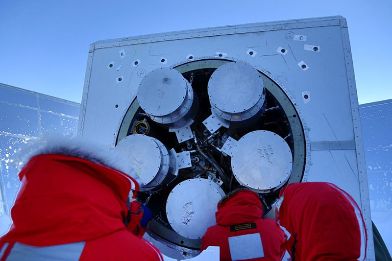 During the brief summer, researchers work to install a receiver on to the Keck array