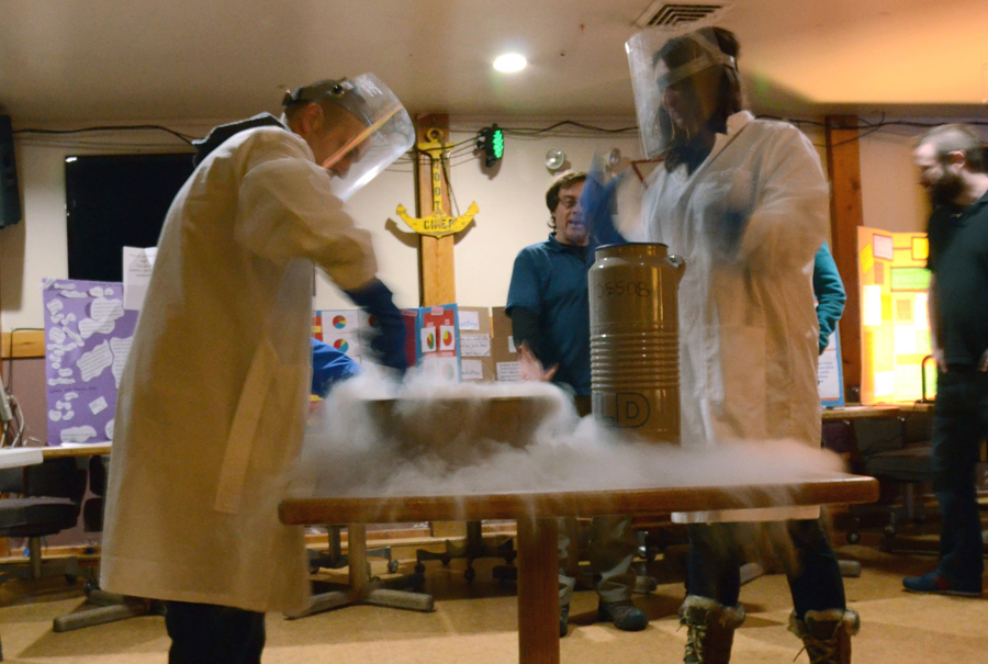 Matt Kehler (left) and Liz Widen use liquid nitrogen to make raspberry sorbet at the annual McMurdo Winter Science Fair