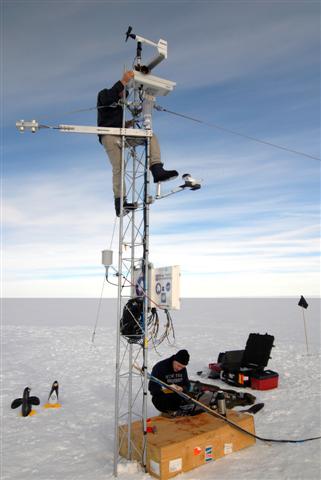 People install a weather station at Pine Island Glacier.