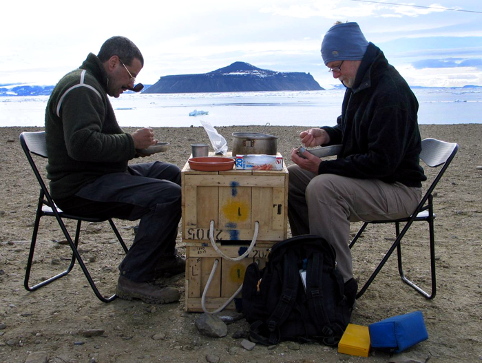 Researchers sift through sediment concentrate for fossils.