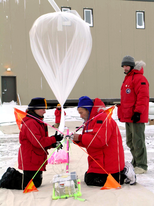 Scientists prepare ozone instruments for launch.