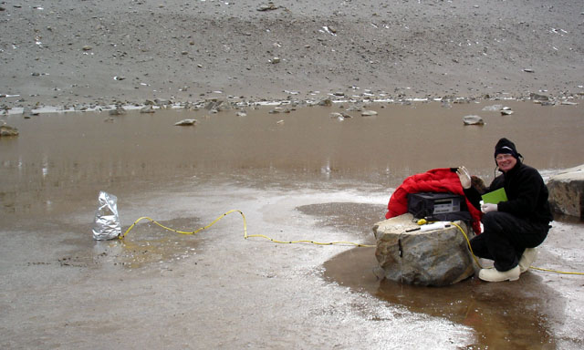 Scientist monitors body of water.