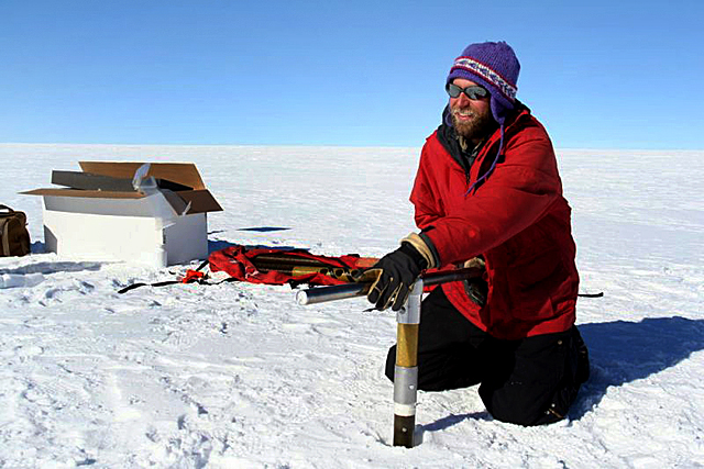 Tom Neumann drills an ice core.
