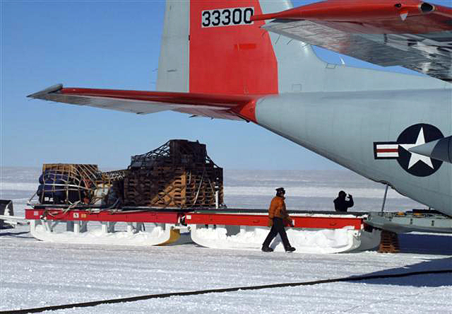 Sleds of cargo unloaded from a plane.